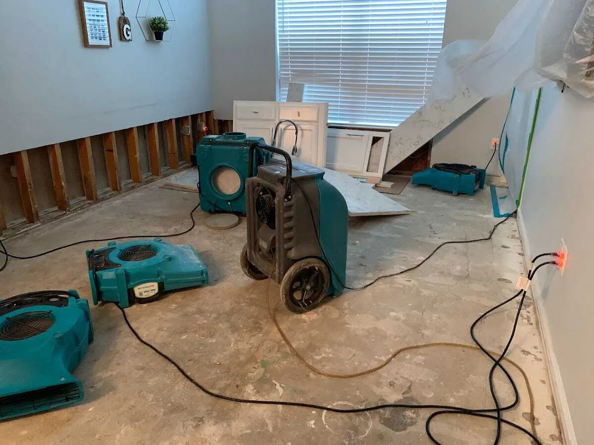 Dehumidifier in flood-cut room for Water Damage Restoration in Four Corners